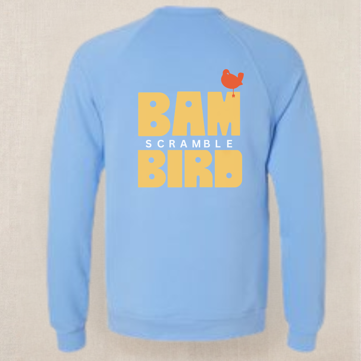 Carolina Blue Bambird Scramble crewneck laid flat from the back, gold BAMBIRD SCRAMBLE print